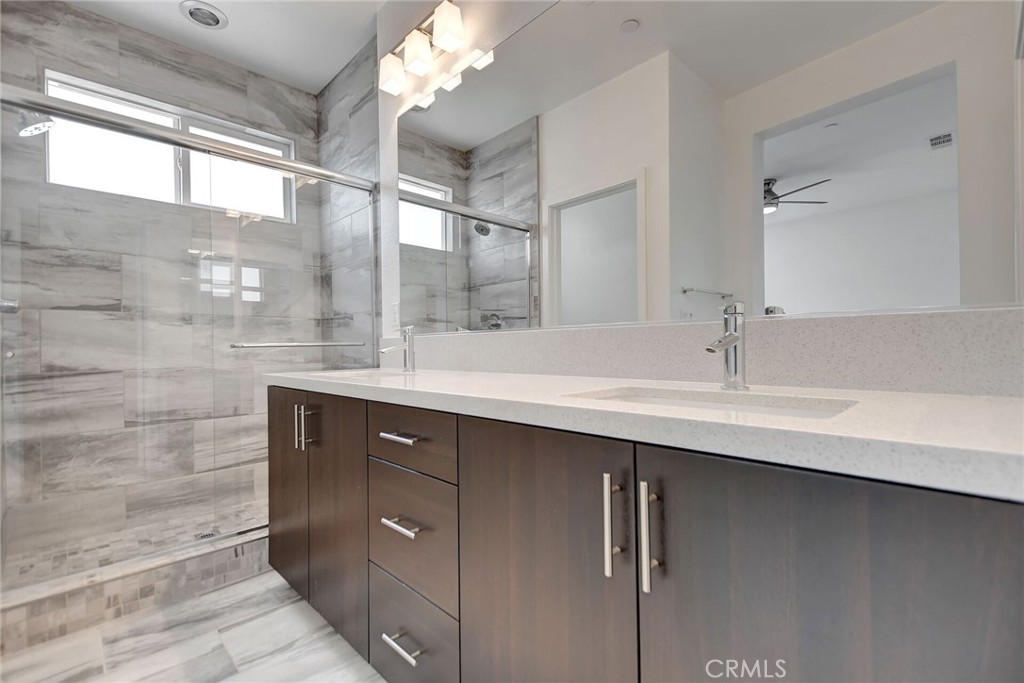 711 Brooklyn Drive Brea, CA 92821 - Photo 26 of 30 a bathroom with a double vanity sink and a mirror
