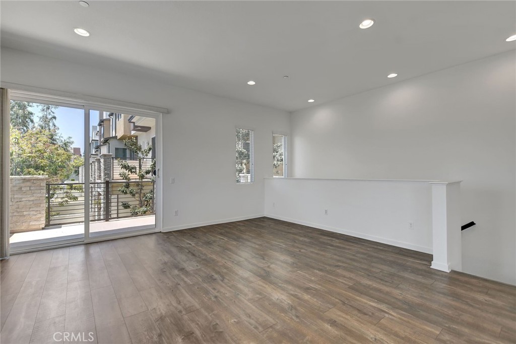 711 Brooklyn Drive Brea, CA 92821 - Photo 7 of 30 a view of an empty room with wooden floor and a window
