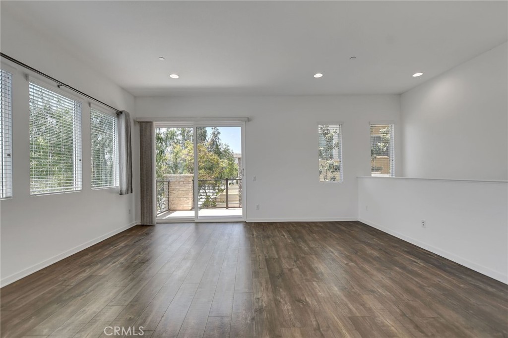 711 Brooklyn Drive Brea, CA 92821 - Photo 8 of 30 a view of an empty room with wooden floor and a window