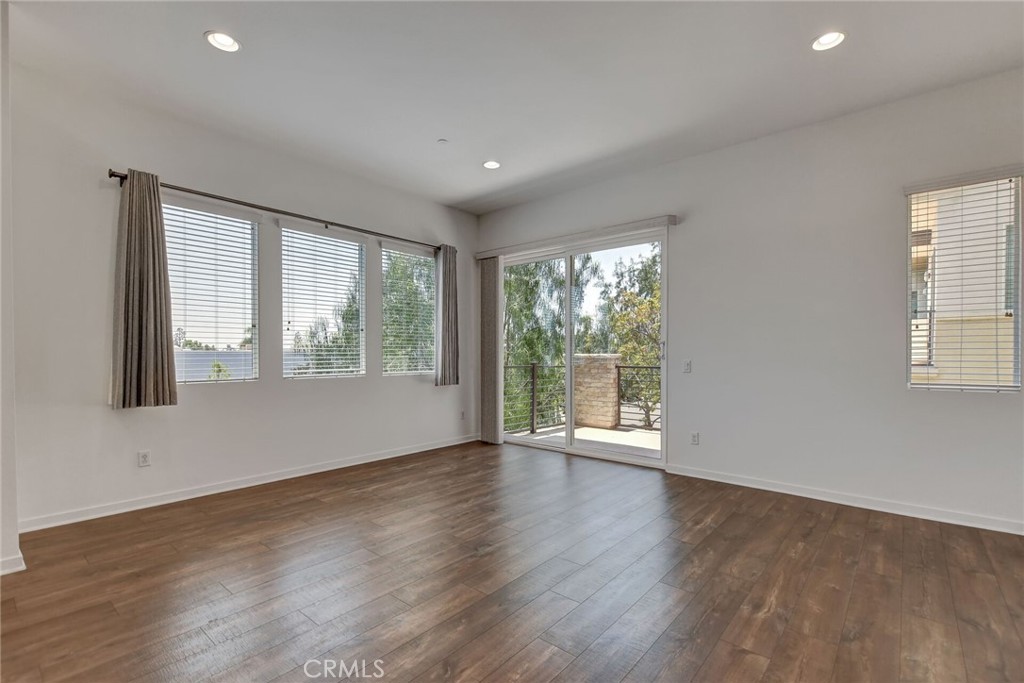 711 Brooklyn Drive Brea, CA 92821 - Photo 9 of 30 a view of an empty room with wooden floor and a window
