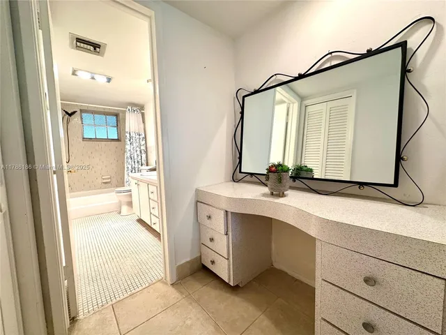a bathroom with a sink a mirror and a bathtub