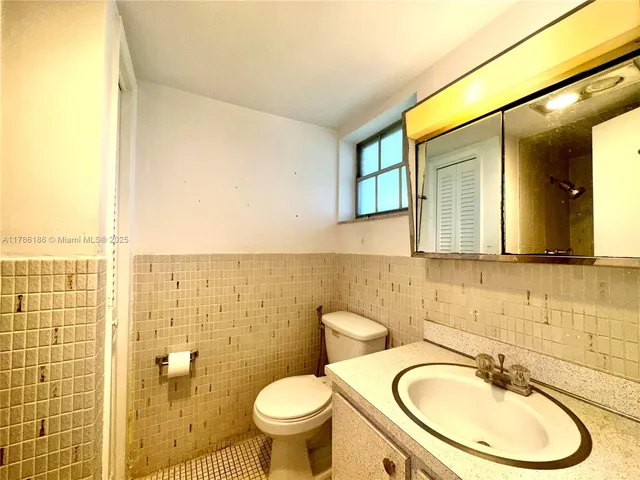 a bathroom with a shower and a sink