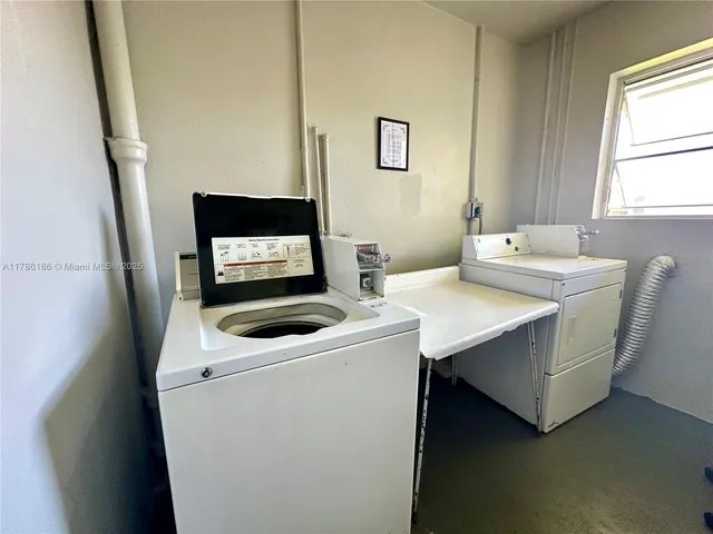 a view of swimming pool with outdoor seating and a yard