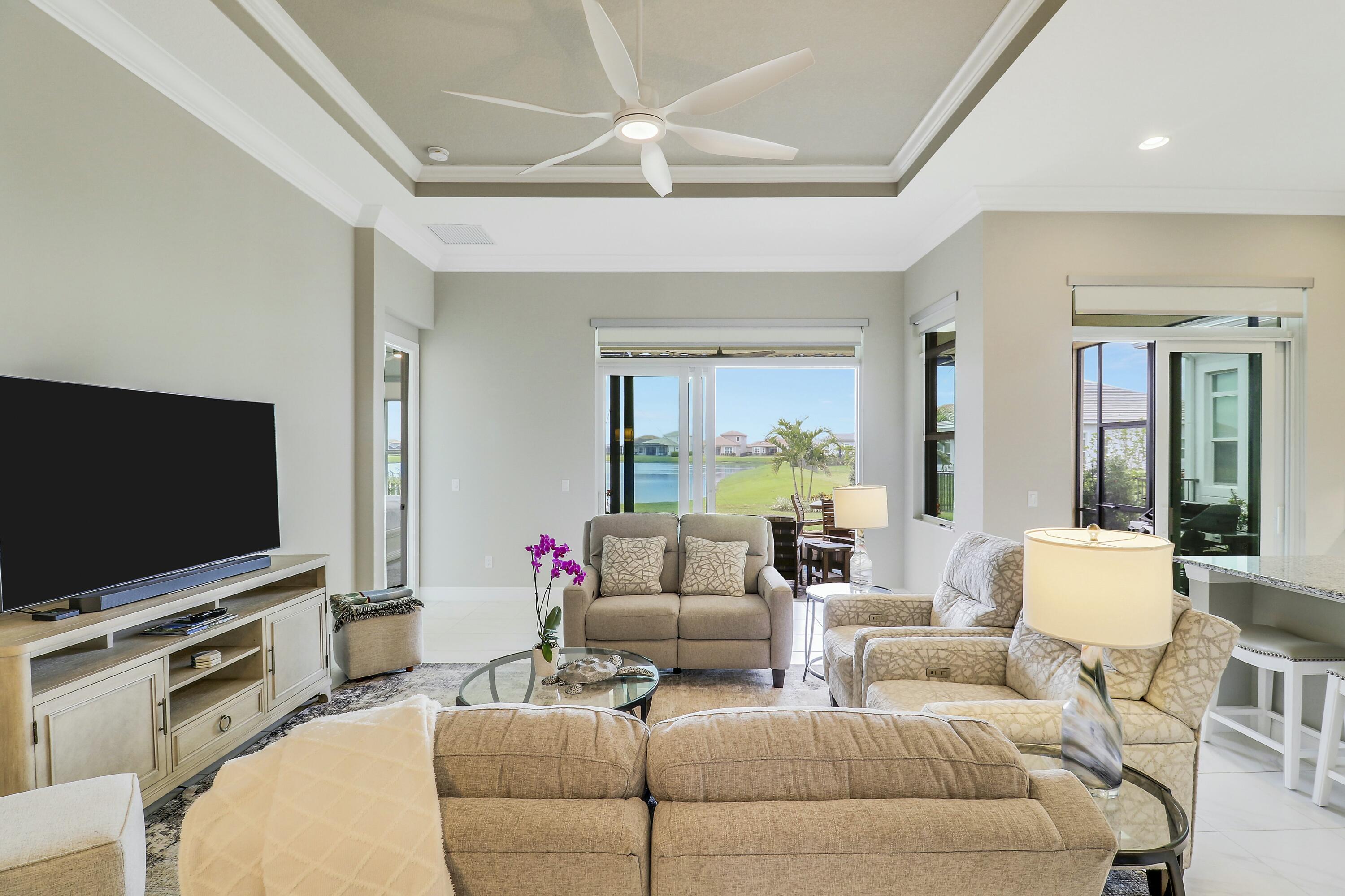 9182 Southwest Pepoli Way Port St. Lucie, FL 34987 - Photo 11 of 80 a living room with furniture and a flat screen tv