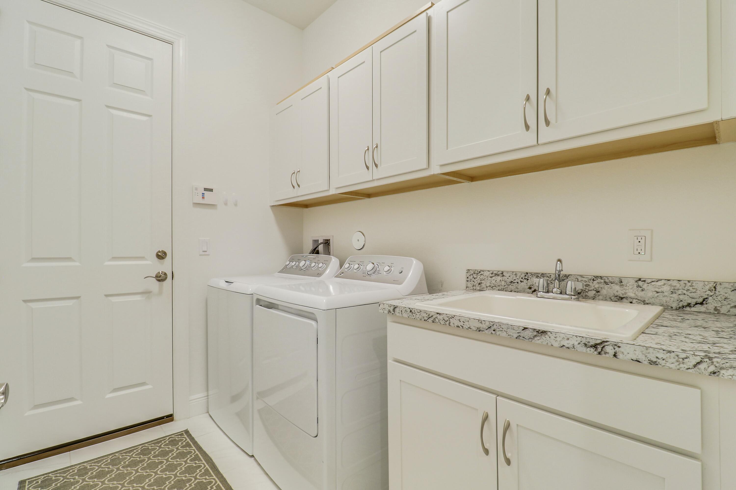 9182 Southwest Pepoli Way Port St. Lucie, FL 34987 - Photo 34 of 80 a utility room with a sink