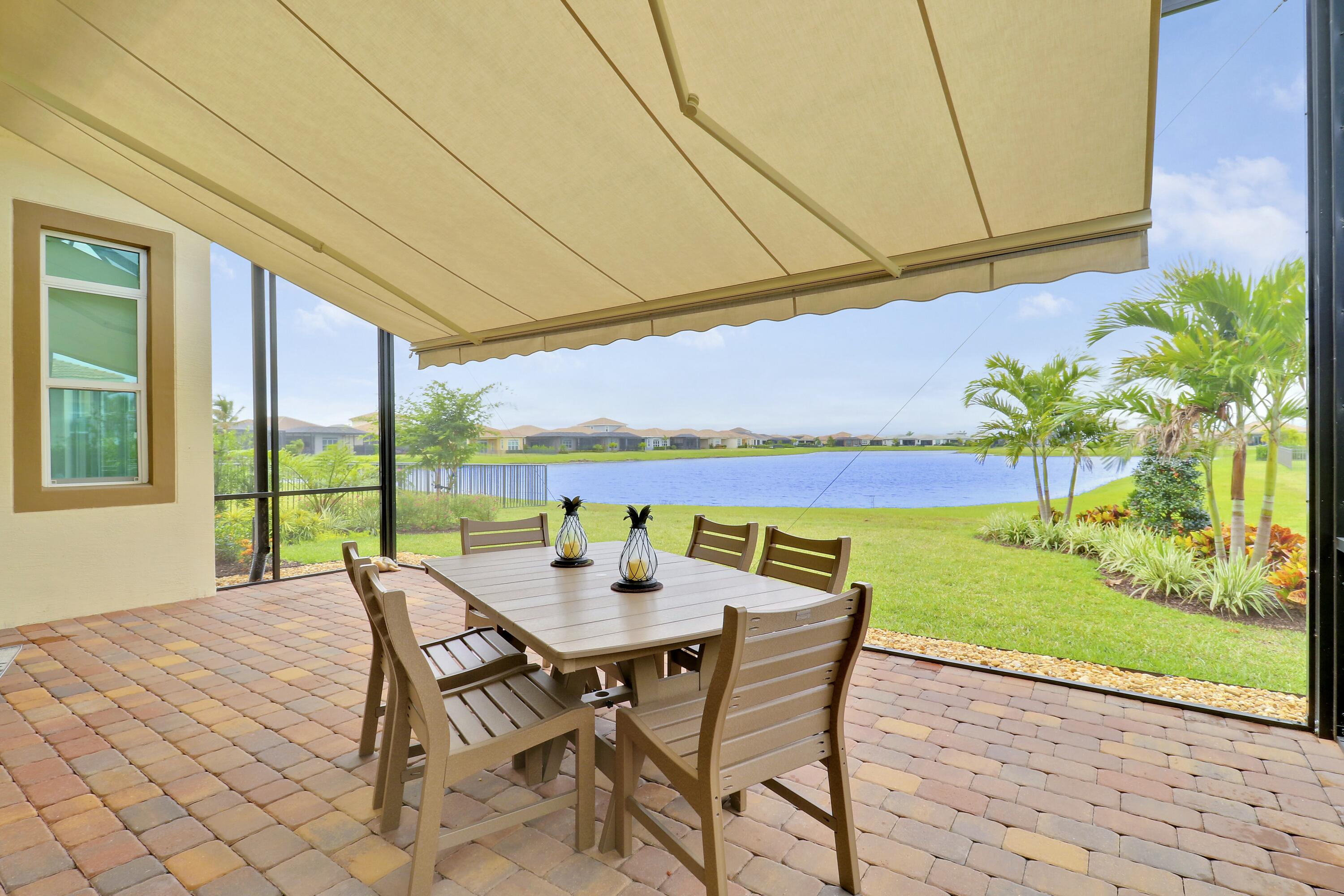 9182 Southwest Pepoli Way Port St. Lucie, FL 34987 - Photo 40 of 80 a view of an outdoor space with furniture and garden