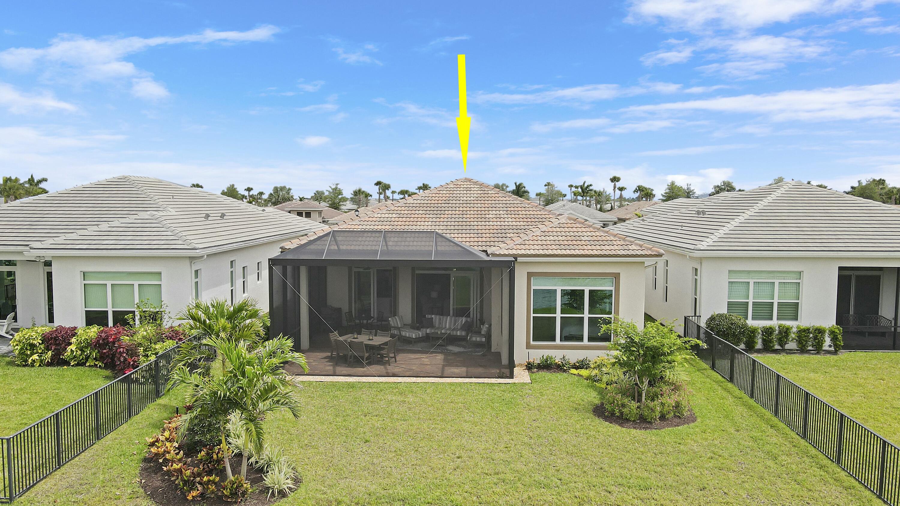 9182 Southwest Pepoli Way Port St. Lucie, FL 34987 - Photo 42 of 80 a front view of a house with a garden