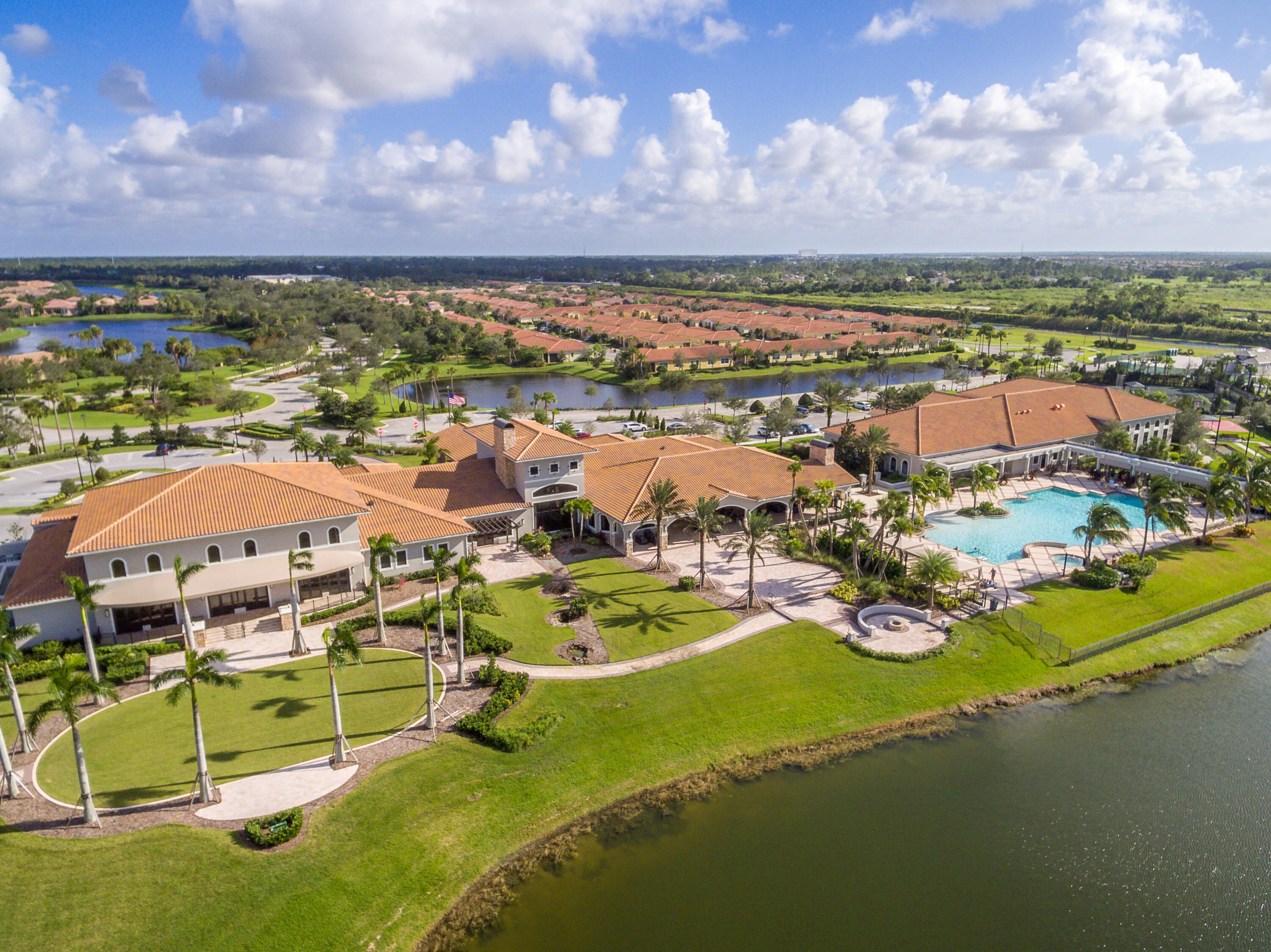9182 Southwest Pepoli Way Port St. Lucie, FL 34987 - Photo 47 of 80 an aerial view of residential houses with outdoor space and lake view