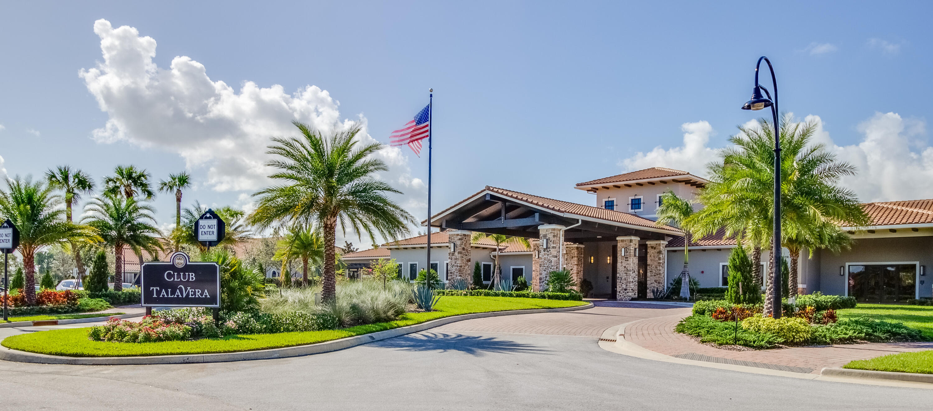 9182 Southwest Pepoli Way Port St. Lucie, FL 34987 - Photo 48 of 80 a front view of a house with a garden and a yard