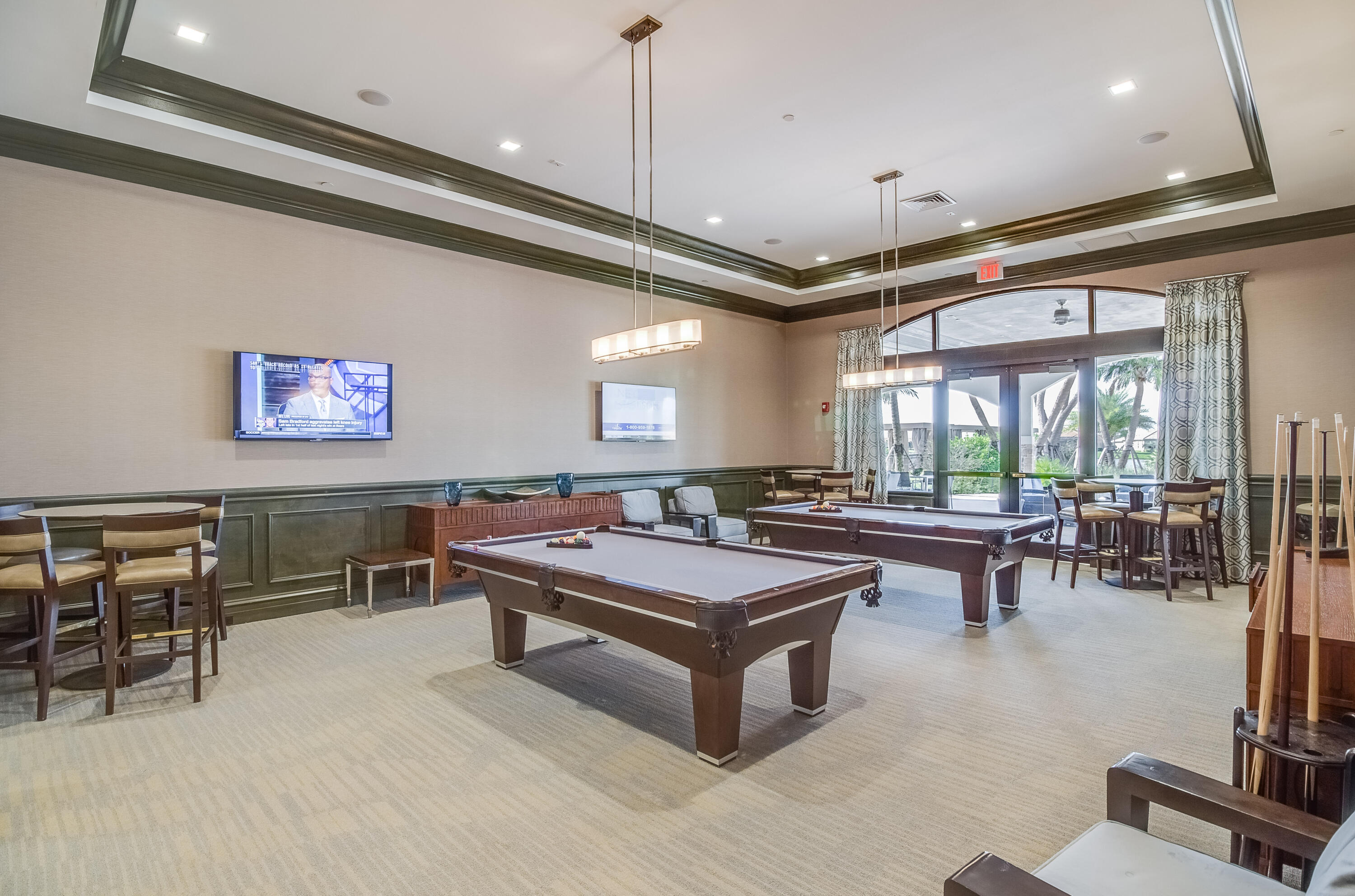 9182 Southwest Pepoli Way Port St. Lucie, FL 34987 - Photo 60 of 80 a view of a lobby with furniture and floor to ceiling window