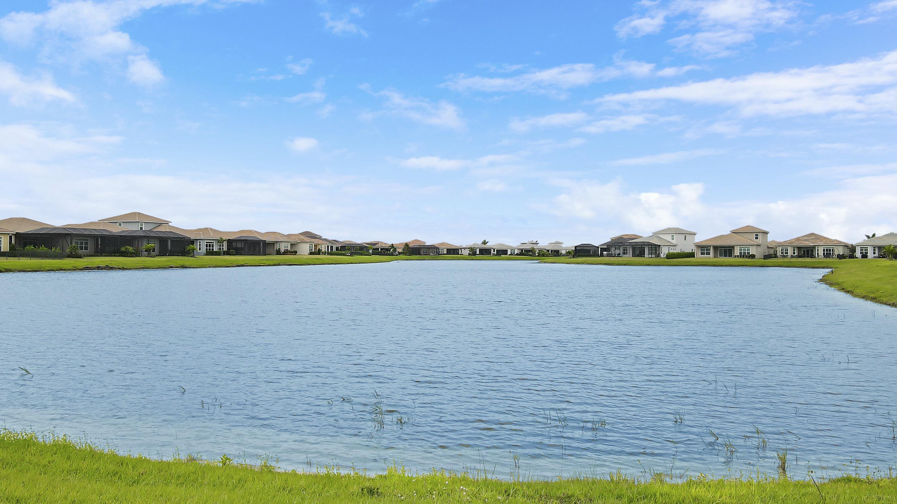 9182 Southwest Pepoli Way Port St. Lucie, FL 34987 - Photo 6 of 80 a view of a lake with a big yard