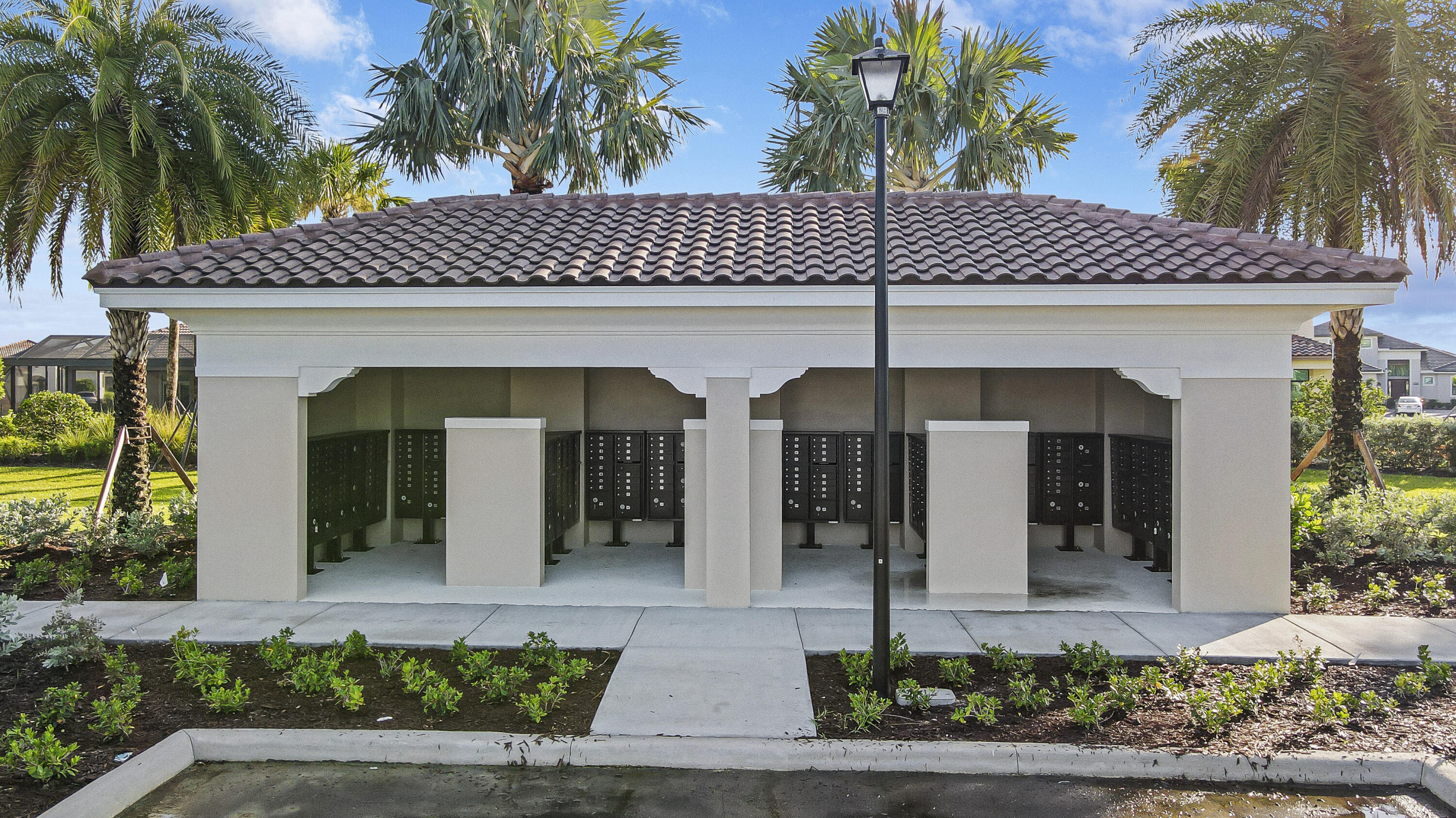 9182 Southwest Pepoli Way Port St. Lucie, FL 34987 - Photo 71 of 80 a front view of a house with plants