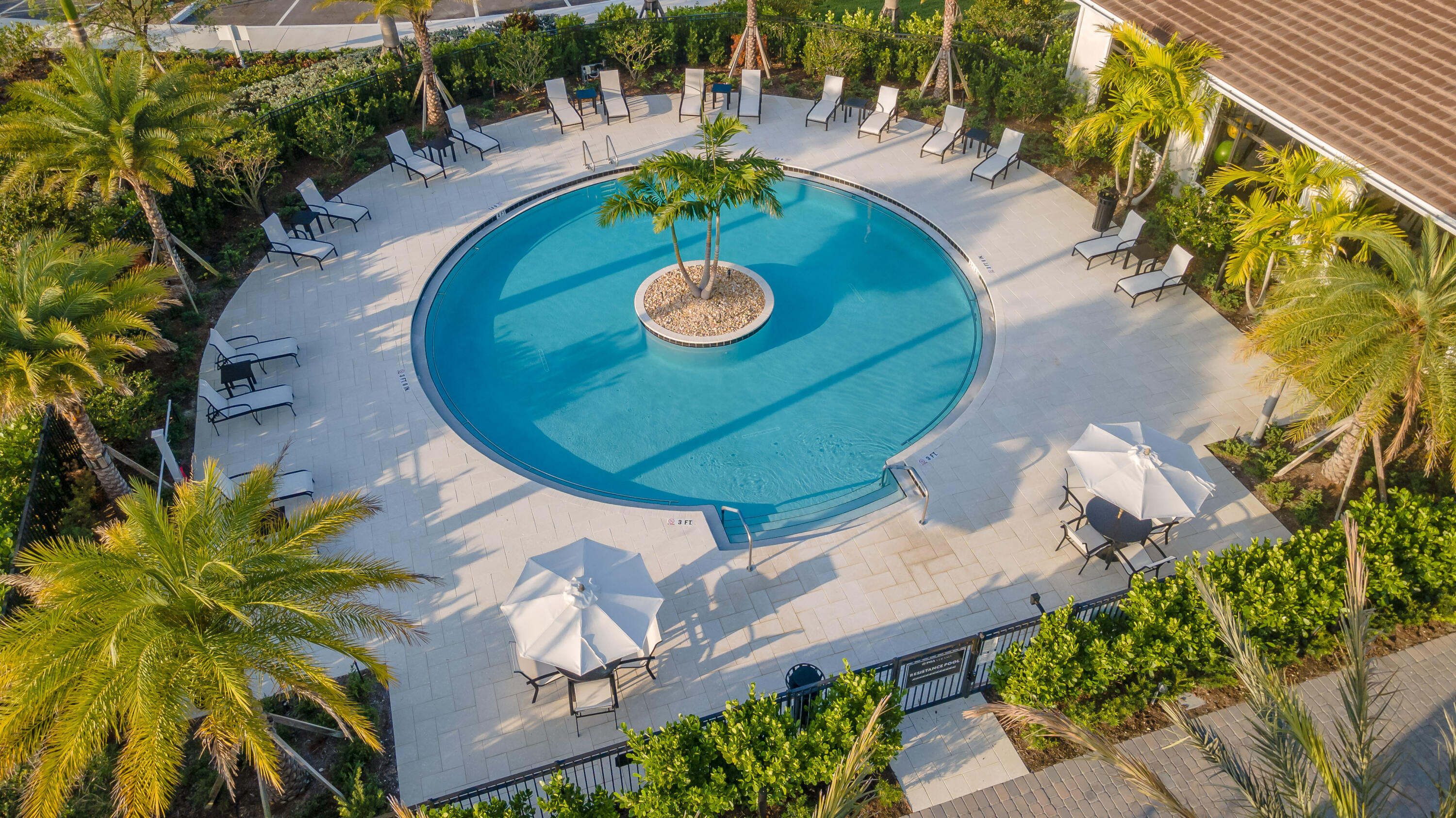 9182 Southwest Pepoli Way Port St. Lucie, FL 34987 - Photo 74 of 80 an aerial view of a swimming pool with outdoor seating