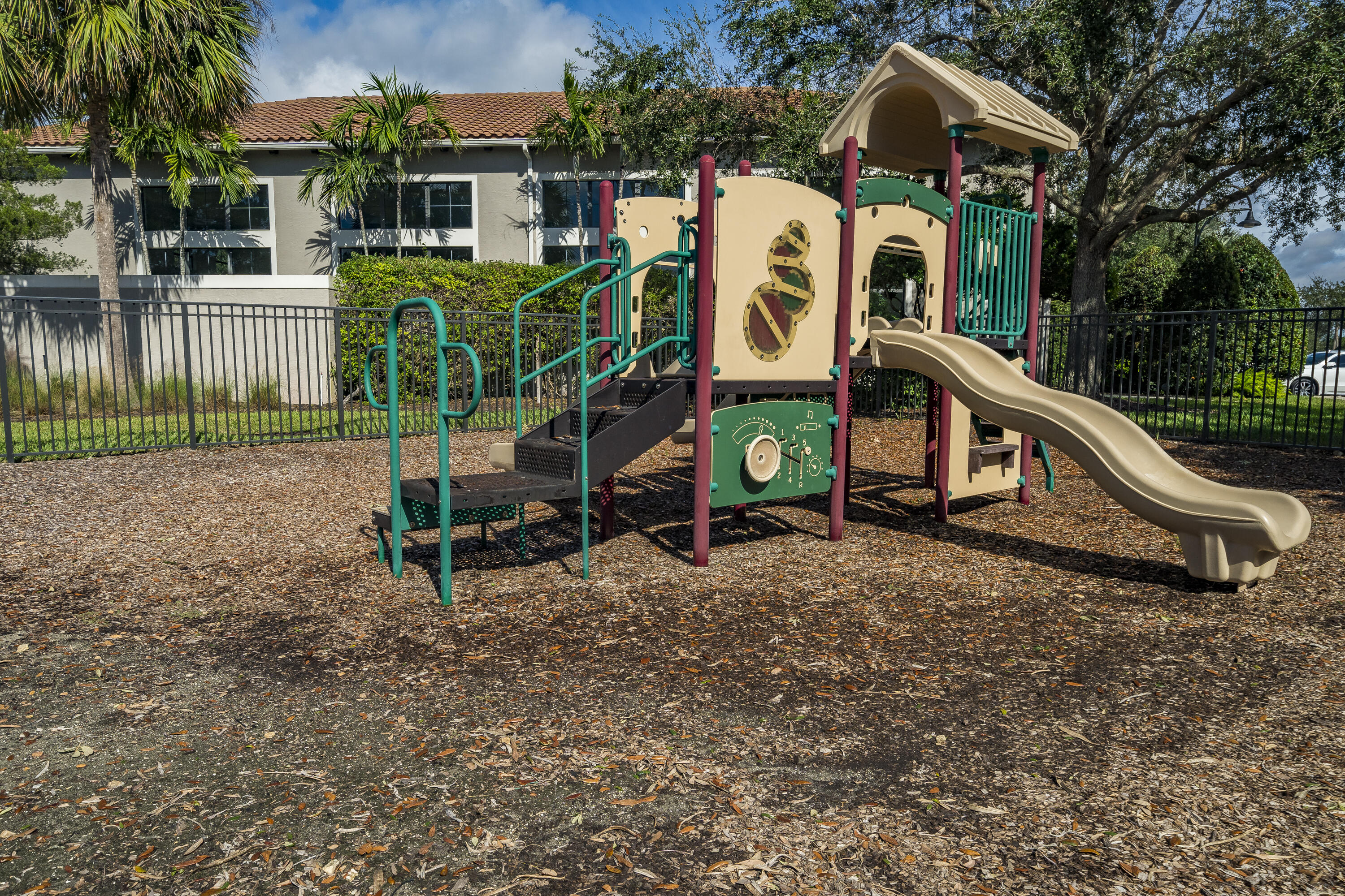 9182 Southwest Pepoli Way Port St. Lucie, FL 34987 - Photo 76 of 80 a childrens park with lots of swings and slides