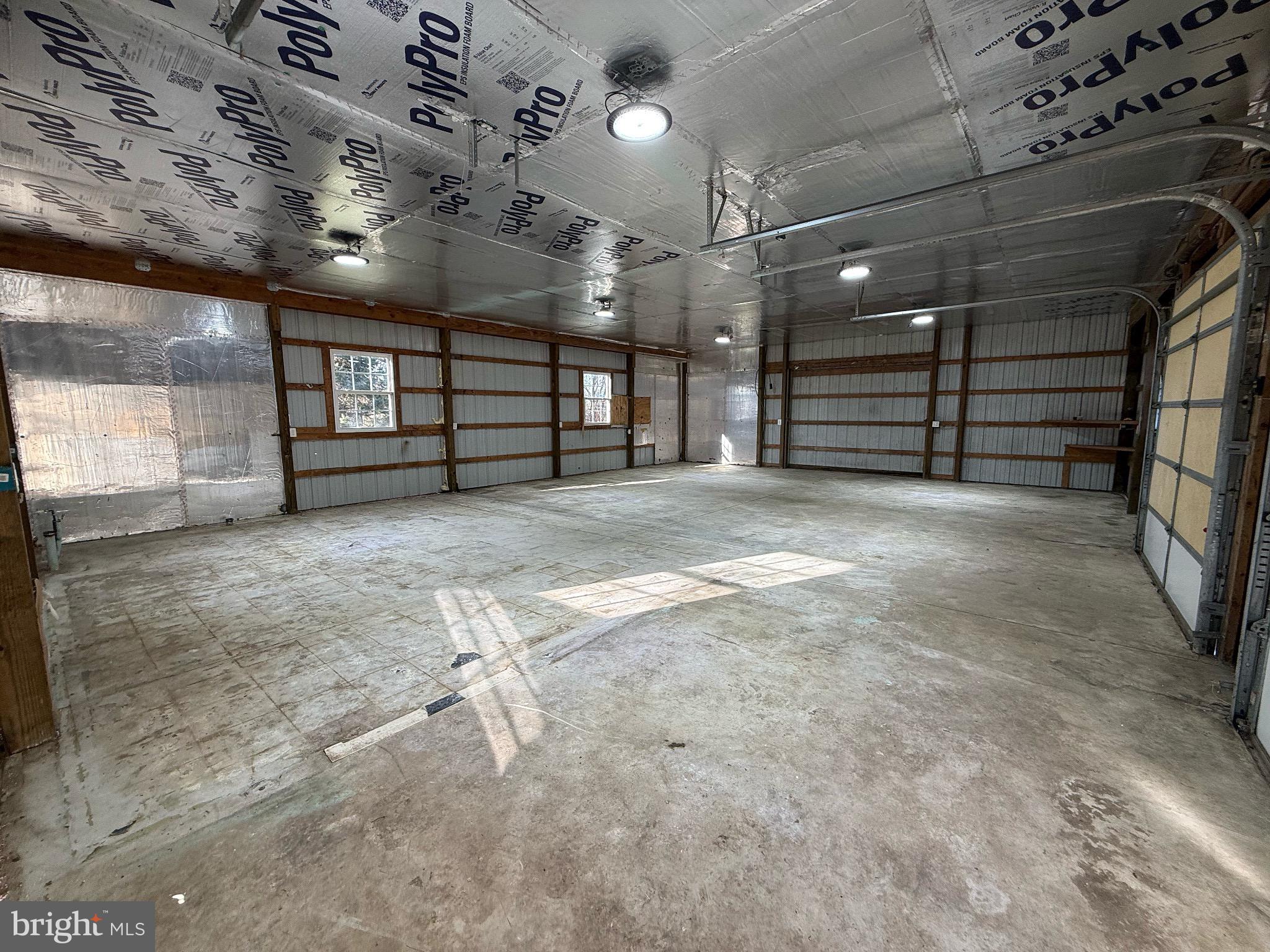 18558 Oak Road Bridgeville, DE 19933 - Photo 35 of 36 Spacious garage with ample natural light.