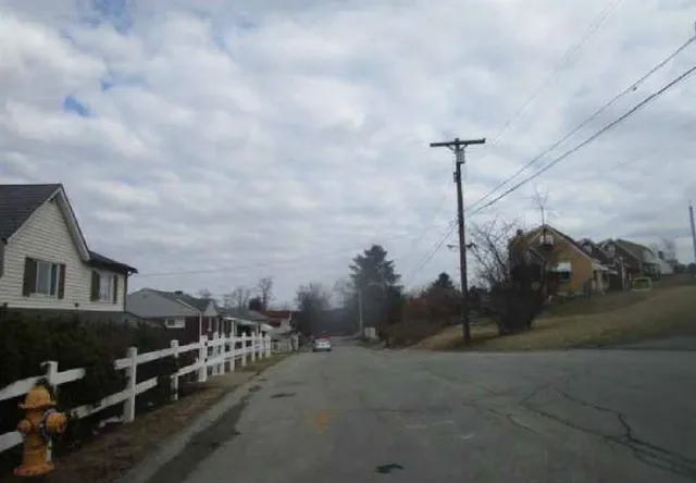 a view of a city street from a house