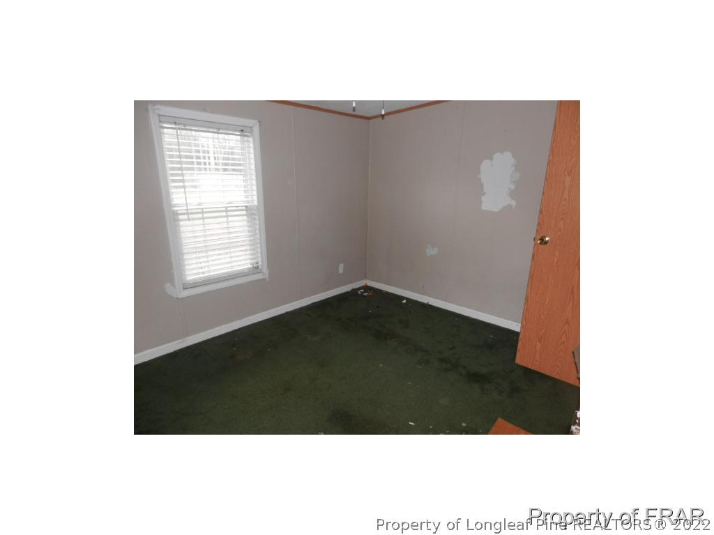 833 Fred Hall Road Stedman, NC 28391 - Photo 8 of 14 a view of an empty room with a window