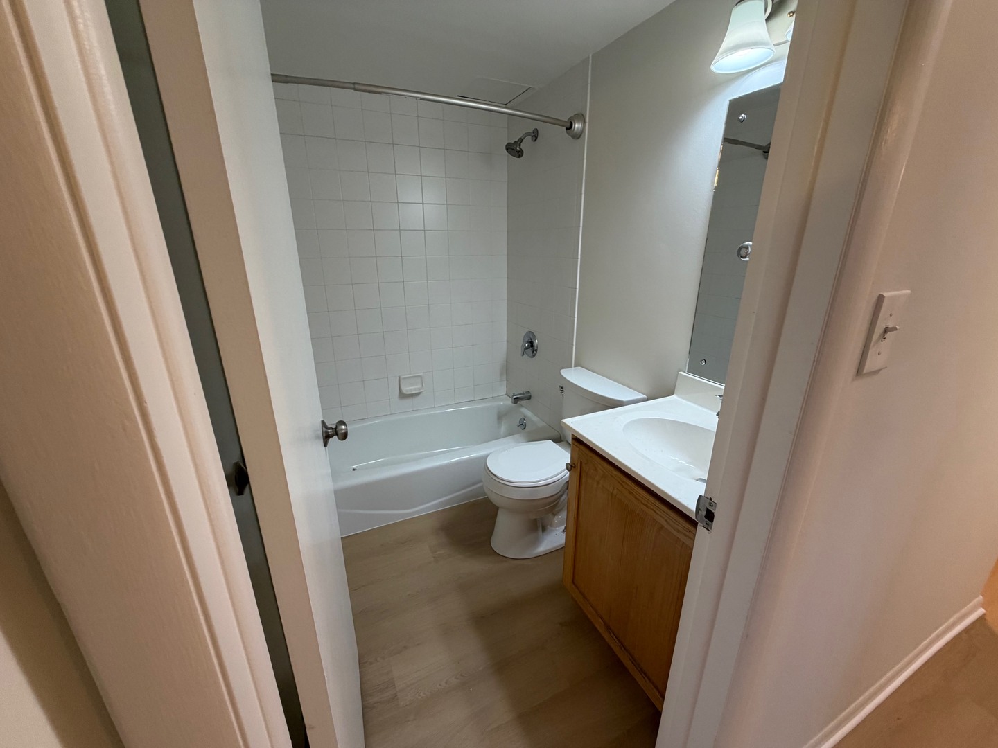 84 West Belvidere Road, Unit 203 Grayslake, IL 60030 - Photo 14 of 15 a bathroom with a sink a toilet and a shower