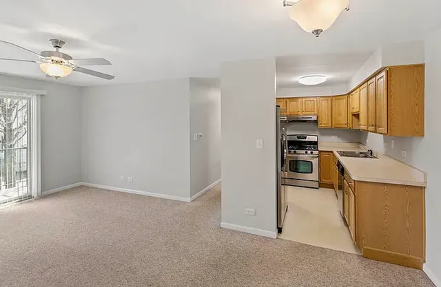 a view of a kitchen with a sink cabinets and window
