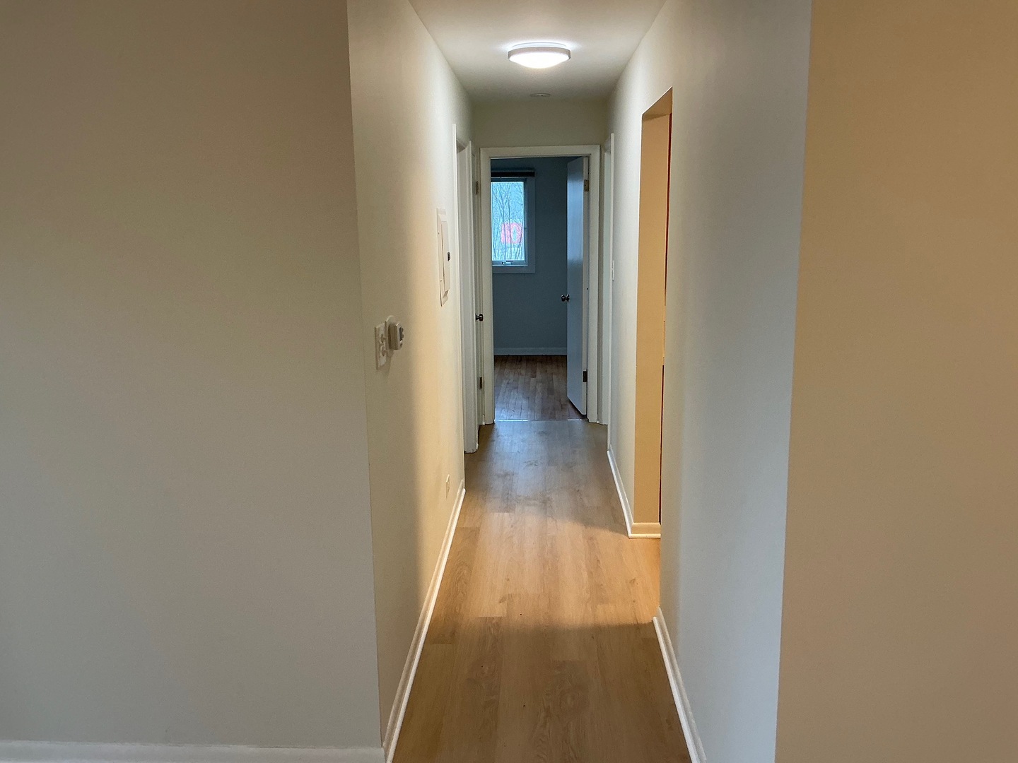 84 West Belvidere Road, Unit 203 Grayslake, IL 60030 - Photo 9 of 15 a view of a hallway with wooden floor