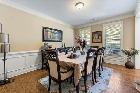 a living room with furniture or couch and a ceiling fan