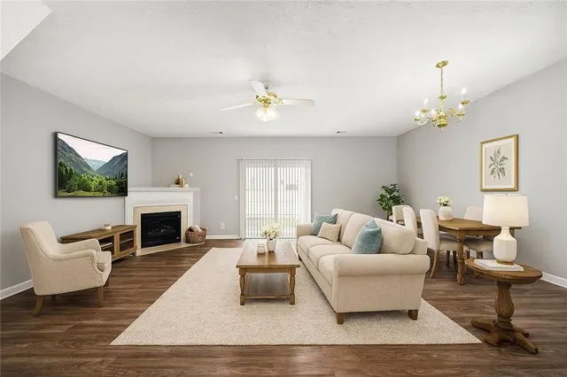 a living room with furniture fireplace and a flat screen tv