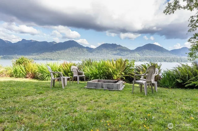 a view of a lake in middle of a forest