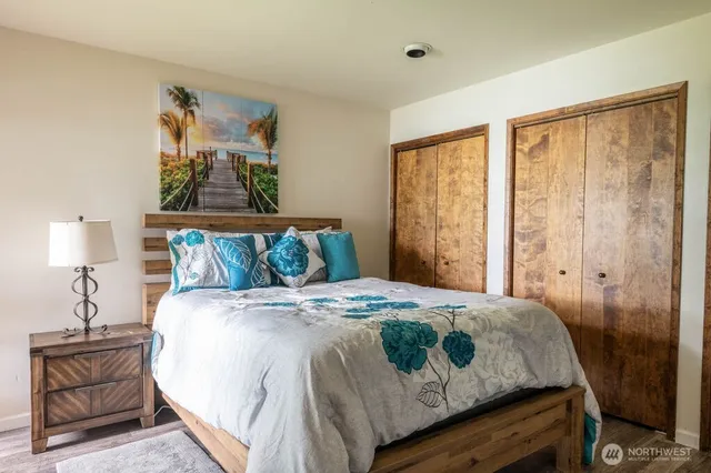 a bedroom with a bed and window