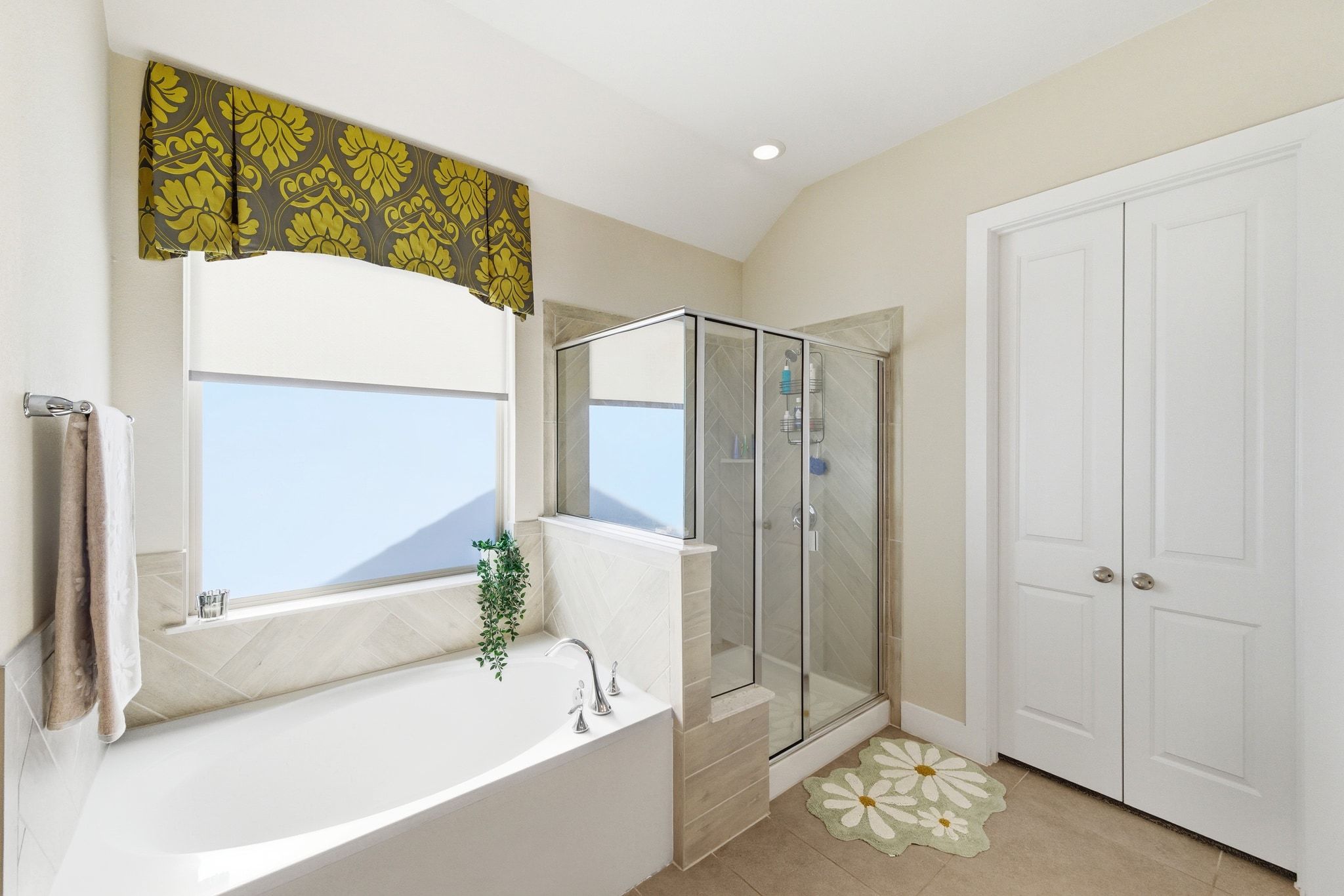 108 Leon Loop Liberty Hill, TX 78642 - Photo 19 of 39 Full bathroom featuring a garden tub, a shower stall, tile patterned flooring, recessed lighting, and lofted ceiling