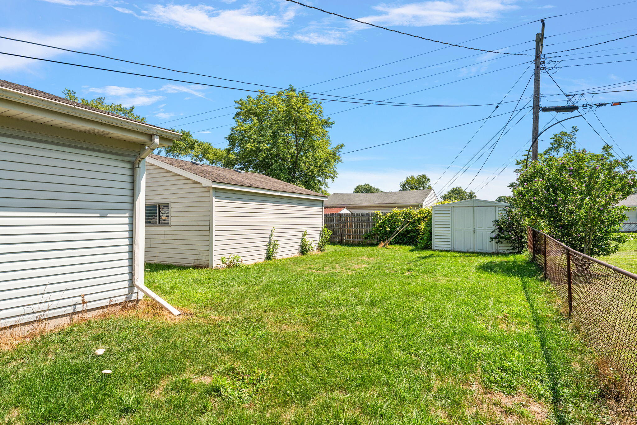 739 Eagle Creek Road Valparaiso, IN 46385 - Photo 20 of 23 a view of a backyard with plants and large trees