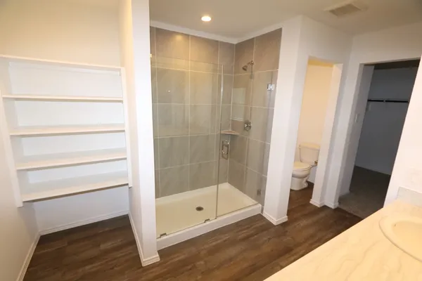 a bathroom with a bathtub and a shower