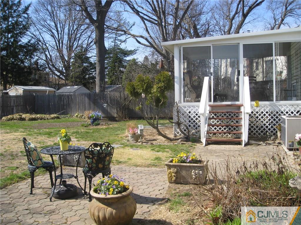 3 Wynn Road Edison, NJ 08817 - Photo 12 of 13 a view of a house with backyard and sitting area