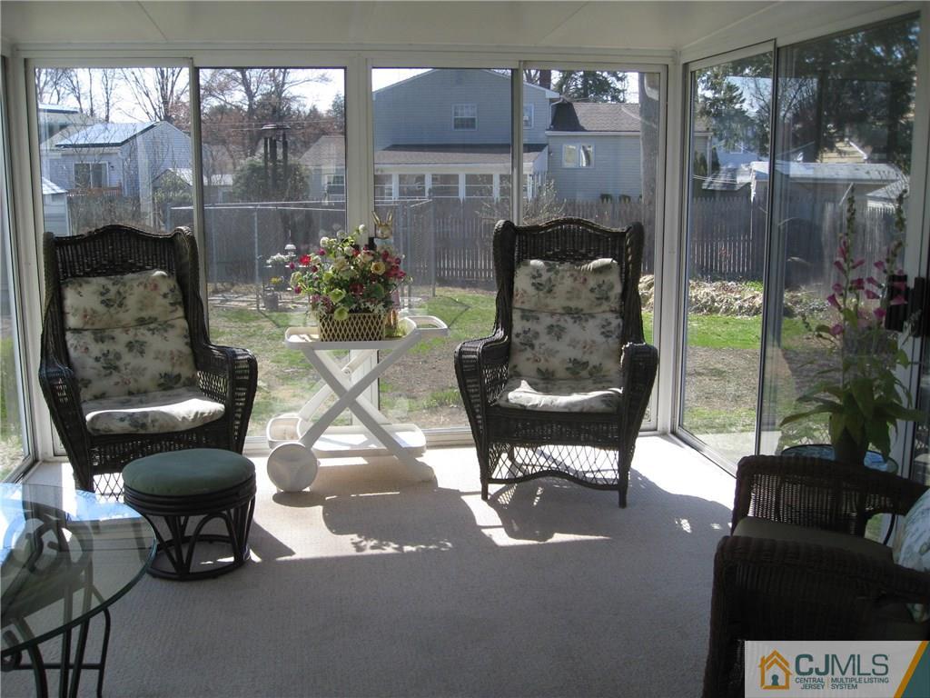 3 Wynn Road Edison, NJ 08817 - Photo 6 of 13 a living room filled with furniture and a potted plant