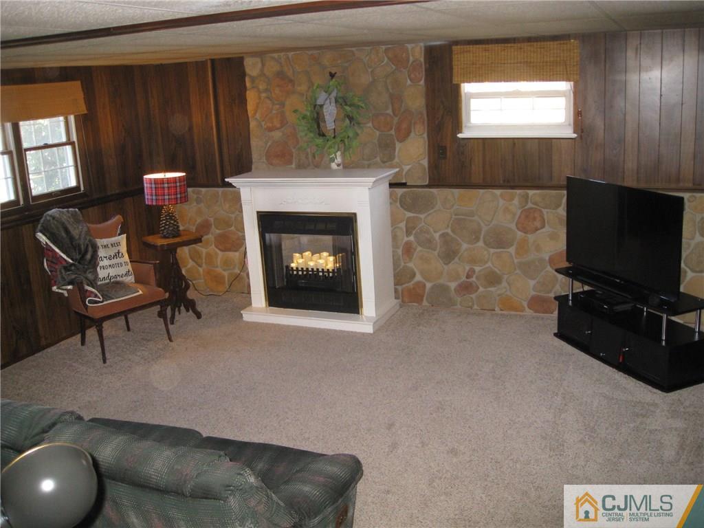 3 Wynn Road Edison, NJ 08817 - Photo 7 of 13 a living room with furniture and a fireplace