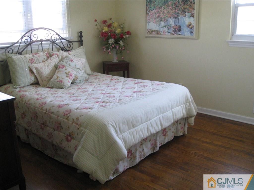 3 Wynn Road Edison, NJ 08817 - Photo 8 of 13 a bedroom with a bed and wooden floor