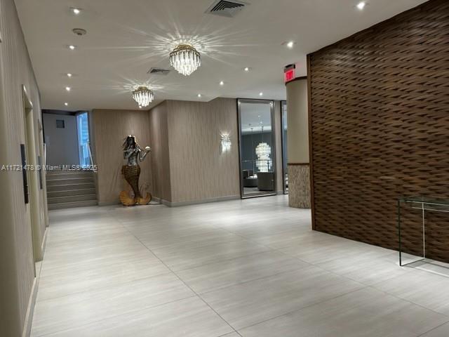 5401 Collins Avenue, Unit 430 Miami Beach, FL 33140 - Photo 13 of 52 a view of a hallway with entryway