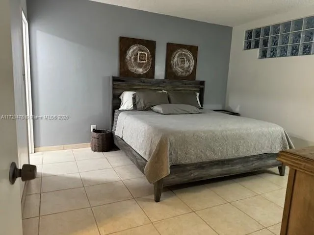 a bedroom with a bed and a table