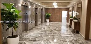 5401 Collins Avenue, Unit 430 Miami Beach, FL 33140 - Photo 8 of 52 a view of entryway with chandelier and front door