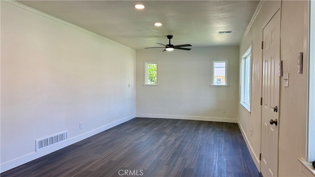 4542 Bandini Avenue Riverside, CA 92506 - Photo 4 of 22 wooden floor in an empty room with a window