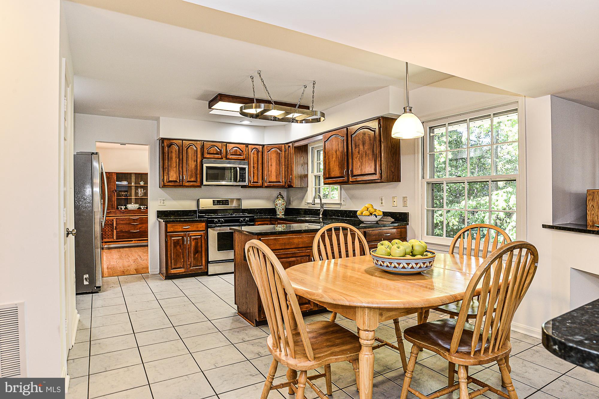 9106 Scott Street Springfield, VA 22153 - Photo 8 of 34 Custom cherry cabinets!