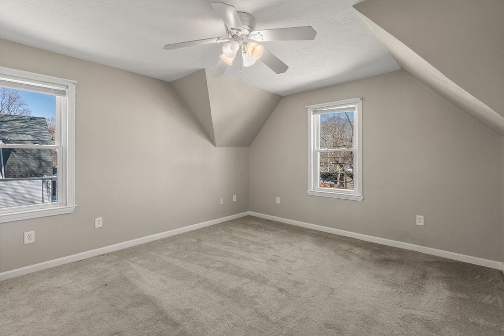 21 Crescent Street Whitman, MA 02382 - Photo 11 of 26 an empty room with windows and fan