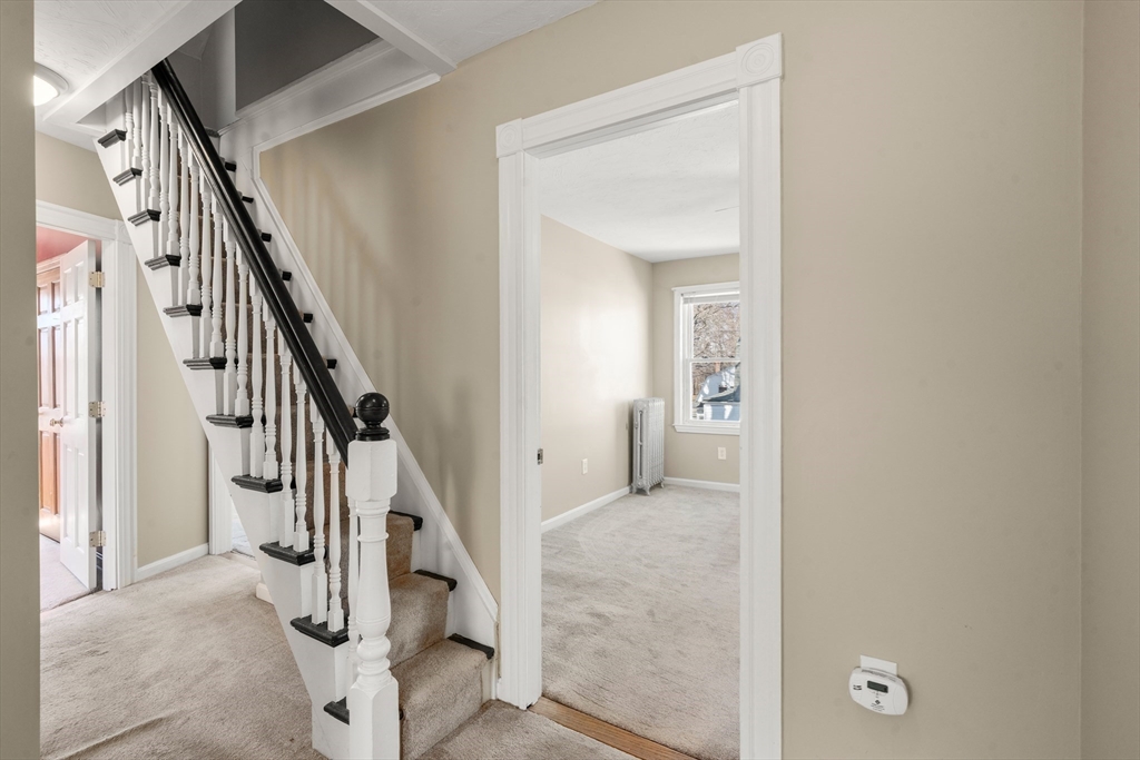 21 Crescent Street Whitman, MA 02382 - Photo 12 of 26 a view of a hallway with staircase
