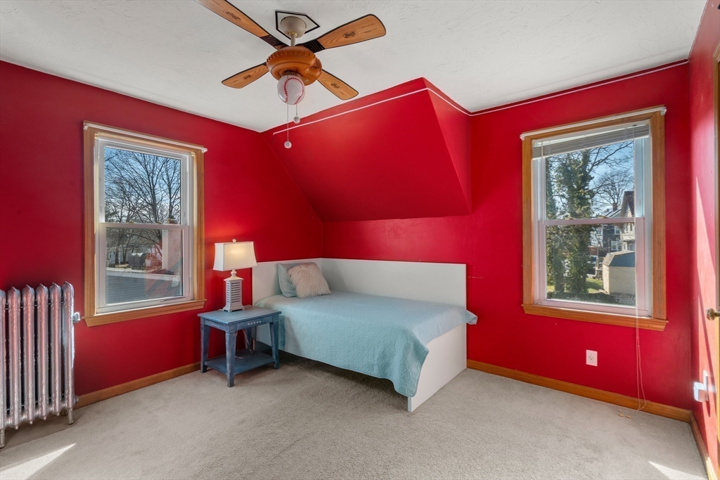 21 Crescent Street Whitman, MA 02382 - Photo 14 of 26 a bedroom with a bed and a window