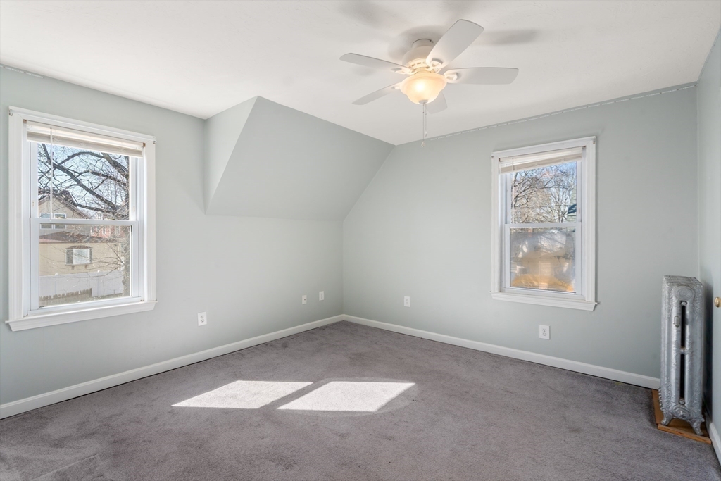 21 Crescent Street Whitman, MA 02382 - Photo 15 of 26 an empty room with windows and fan