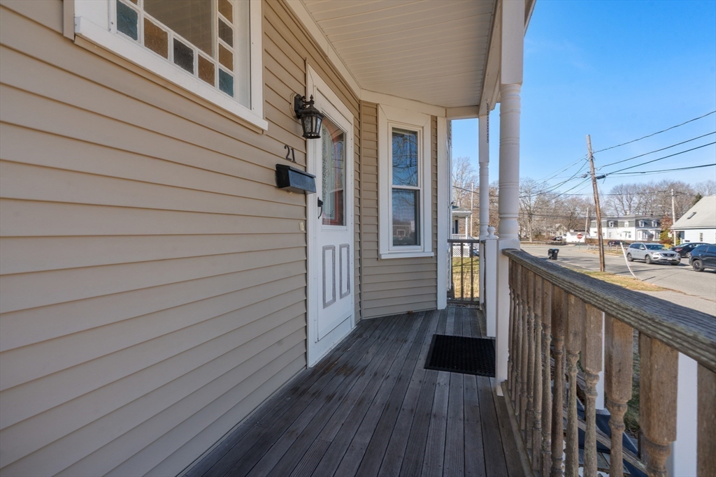 21 Crescent Street Whitman, MA 02382 - Photo 19 of 26 a view of a balcony with wooden floor and fence