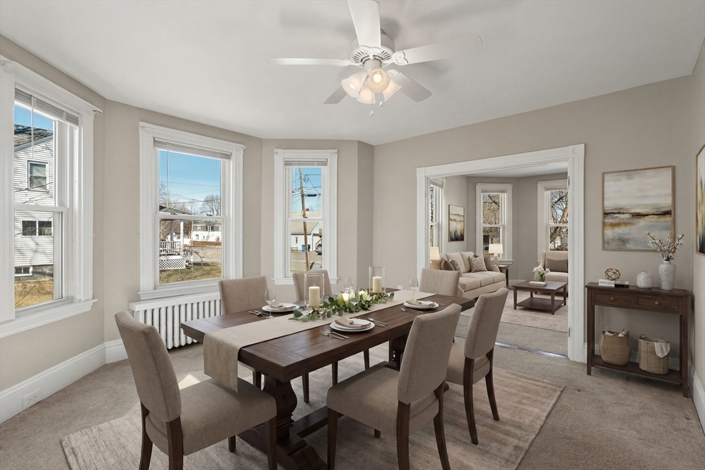 21 Crescent Street Whitman, MA 02382 - Photo 2 of 26 a view of a dining room with furniture and a chandelier