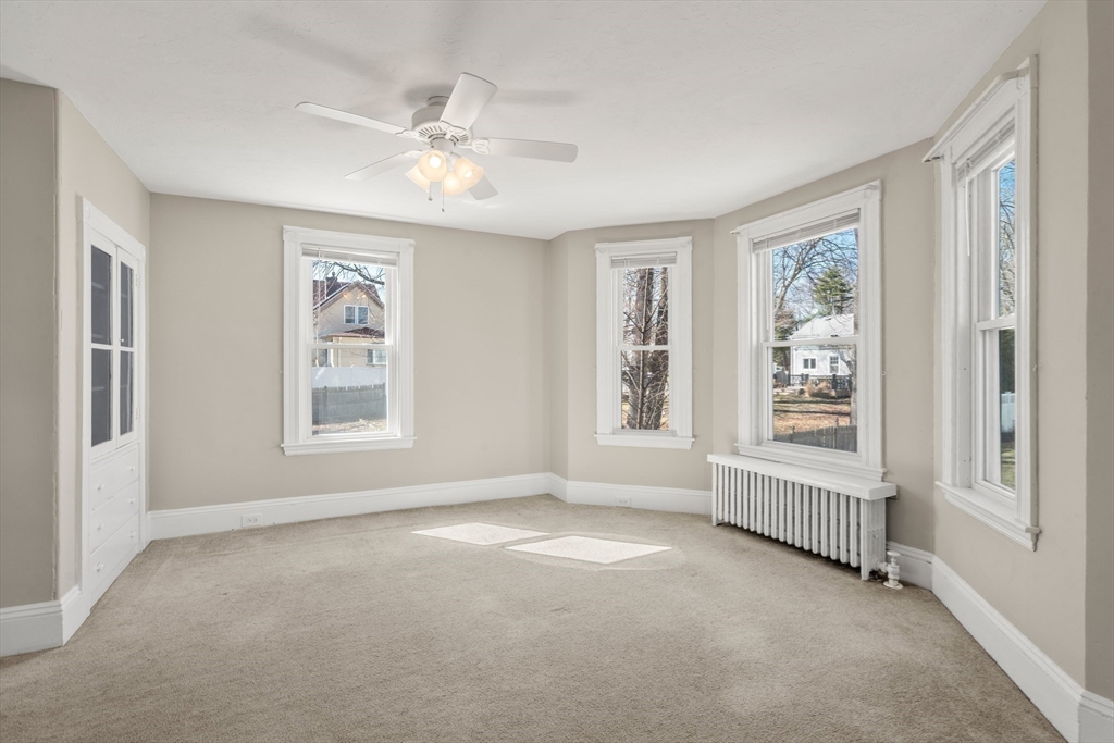 21 Crescent Street Whitman, MA 02382 - Photo 5 of 26 a view of an empty room with a window