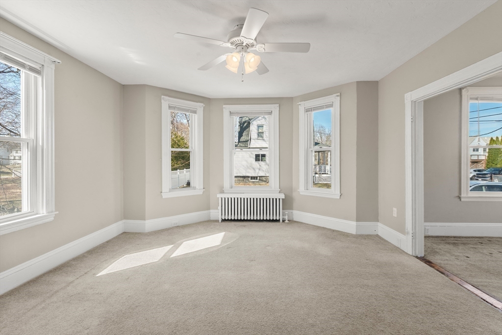 21 Crescent Street Whitman, MA 02382 - Photo 6 of 26 a view of an empty room with a window