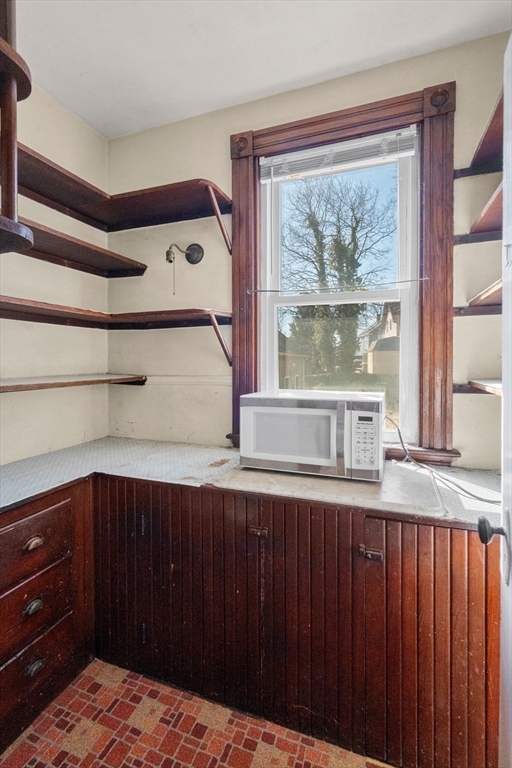 21 Crescent Street Whitman, MA 02382 - Photo 9 of 26 a bedroom with a bed and large windows