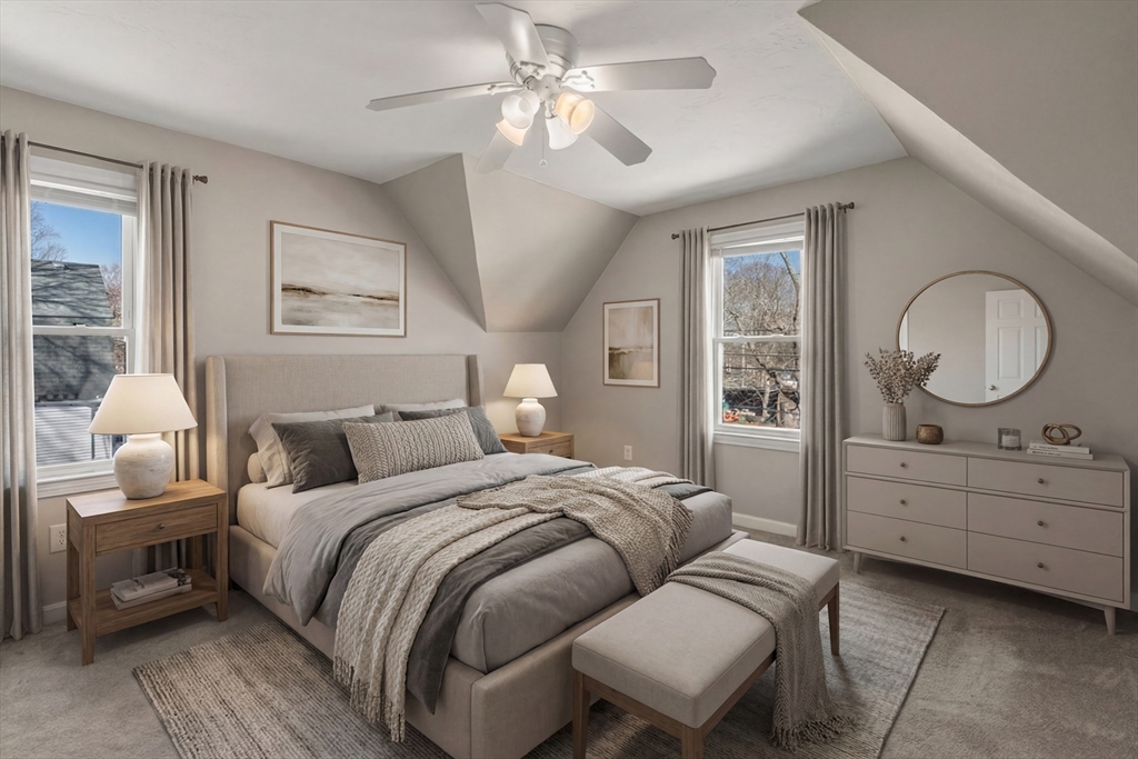 21 Crescent Street Whitman, MA 02382 - Photo 10 of 26 a bedroom with a bed a chandelier and dresser